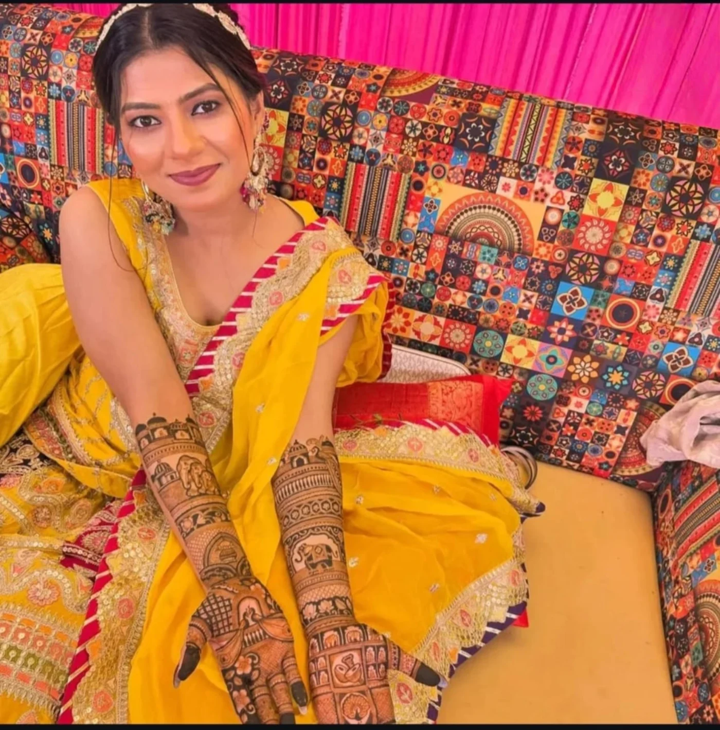 Mehndi portrait in a yellow celebration outfit