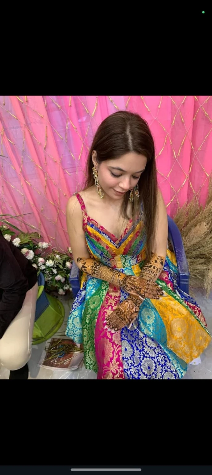 Mehndi appointment photograph in a colourful outfit