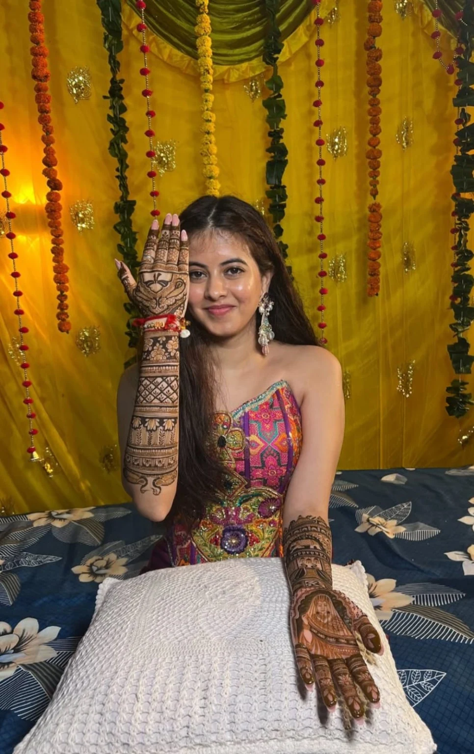 Detailed mehndi hands at a celebration
